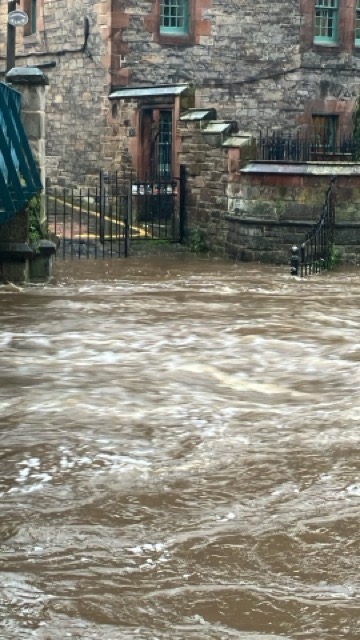 The ramp down to the Water of Leith walkway entirely underwater